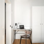 Cozy workspace in MIRO Rooms Riga with desk and chair.
