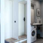Modern bathroom and hallway at MIRO Rooms in Riga.