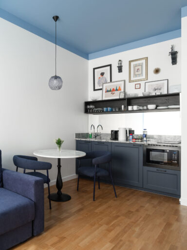 Modern kitchen area in MIRO Rooms, Riga accommodations.