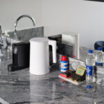 Modern kitchen amenities at MIRO Rooms in Riga accommodation.