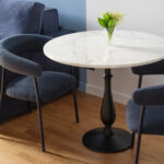 Stylish table and chairs in a modern room at MIRO Rooms, Riga.