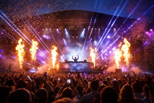 Vibrant concert scene with fireworks, perfect for Riga tourism.